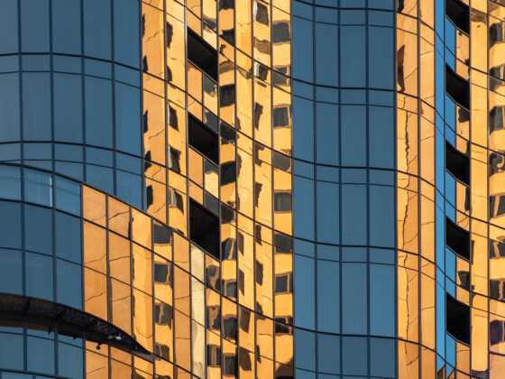 Orange light reflection on glass office building